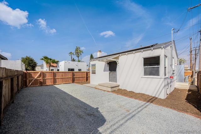 rear view of property featuring a patio area