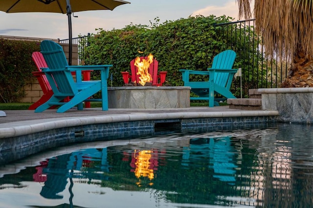 view of pool with a fire pit