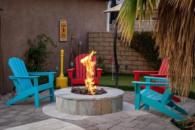 view of patio / terrace with a fire pit