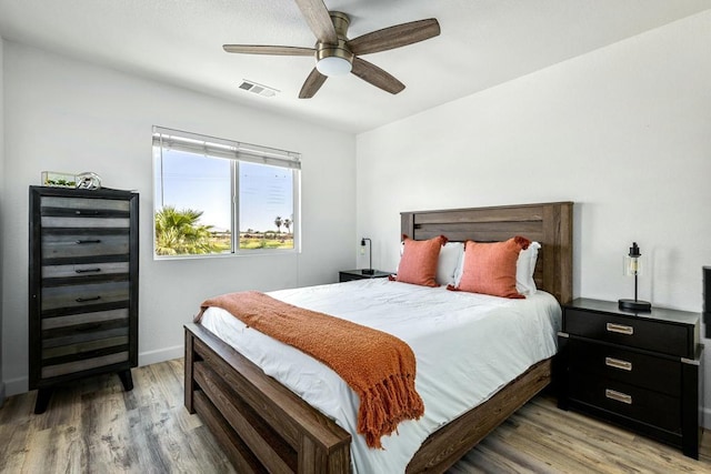 bedroom featuring ceiling fan and light hardwood / wood-style flooring