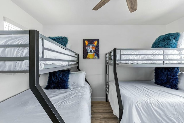 bedroom with ceiling fan and wood-type flooring