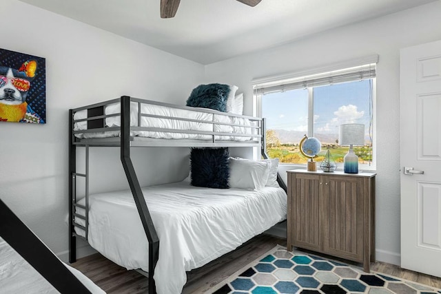 bedroom featuring hardwood / wood-style flooring and ceiling fan