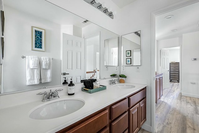 bathroom featuring vanity and wood-type flooring