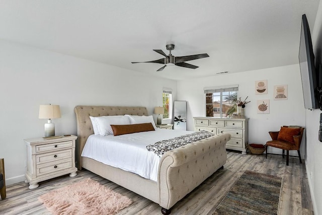 bedroom featuring hardwood / wood-style flooring and ceiling fan