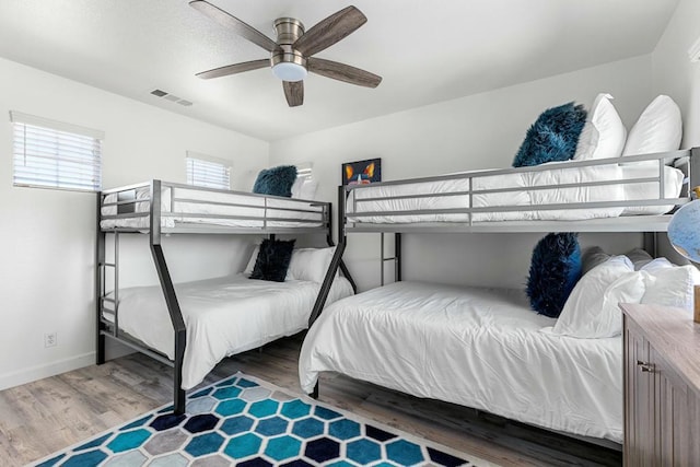 bedroom featuring dark wood-type flooring and ceiling fan