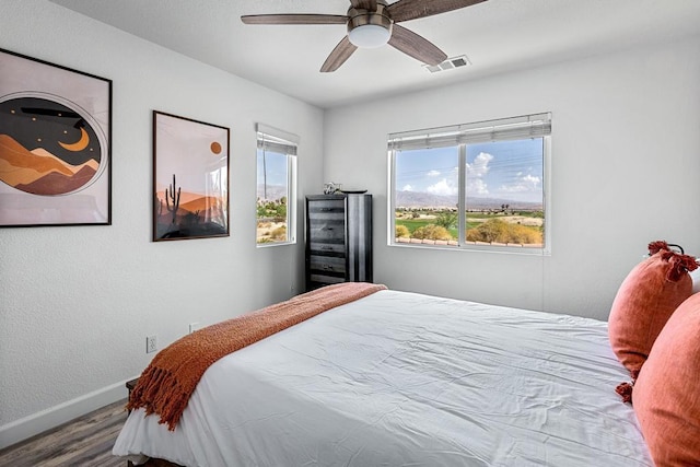 bedroom featuring hardwood / wood-style flooring and ceiling fan