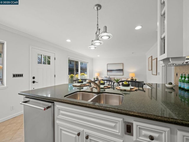 kitchen with light tile patterned flooring, dishwasher, sink, white cabinets, and hanging light fixtures