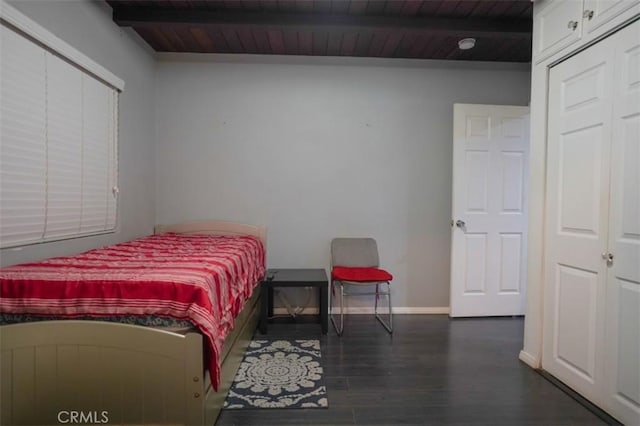 bedroom with wood ceiling, dark hardwood / wood-style flooring, and beam ceiling