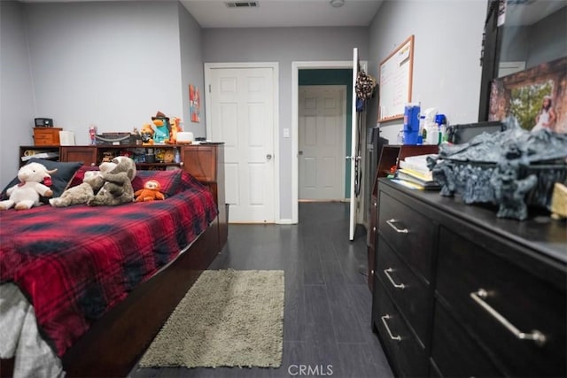 bedroom featuring dark hardwood / wood-style floors