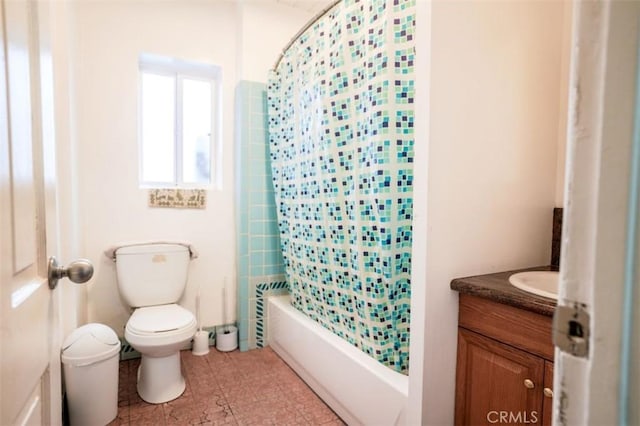 full bathroom featuring toilet, tile patterned floors, vanity, and shower / tub combo