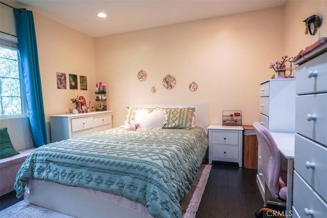 bedroom featuring dark hardwood / wood-style flooring