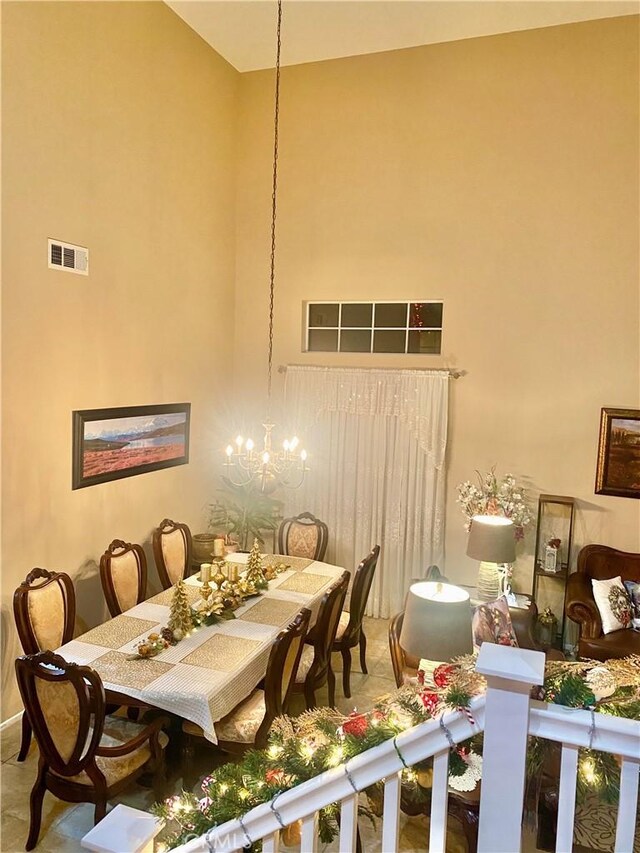 dining area featuring a notable chandelier