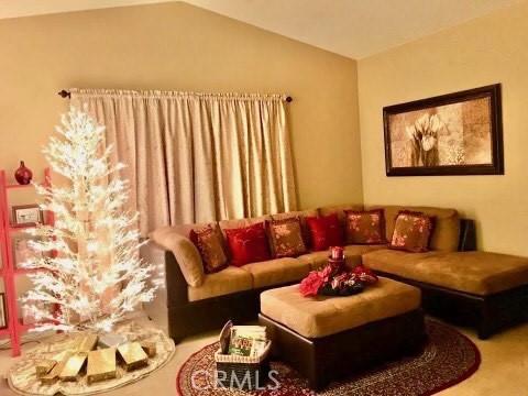 living room with vaulted ceiling