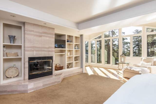 bedroom with a fireplace and carpet flooring