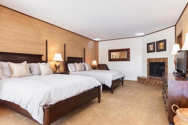 bedroom featuring crown molding, a fireplace, and light colored carpet