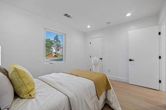 bedroom with light hardwood / wood-style flooring