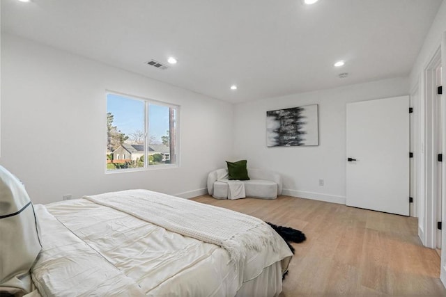 bedroom featuring light hardwood / wood-style floors