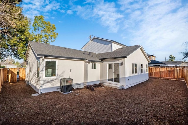 back of house featuring cooling unit