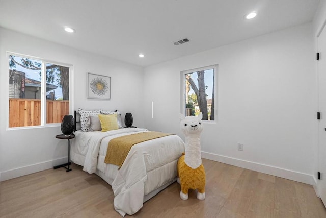 bedroom with light hardwood / wood-style flooring