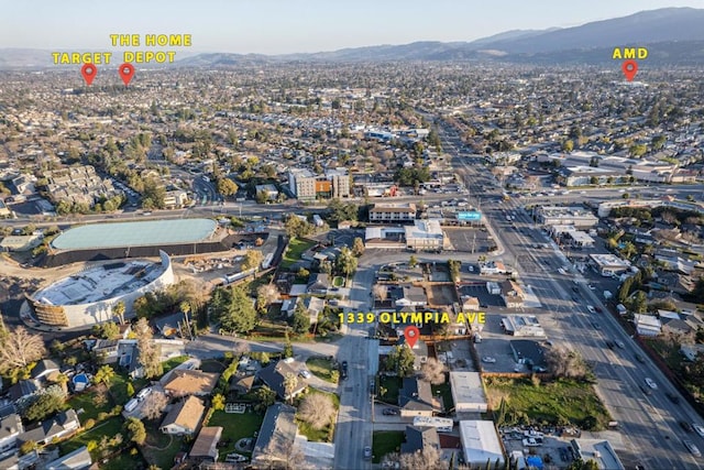 birds eye view of property with a mountain view