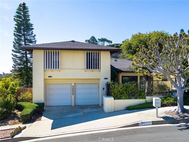 view of front of property with a garage