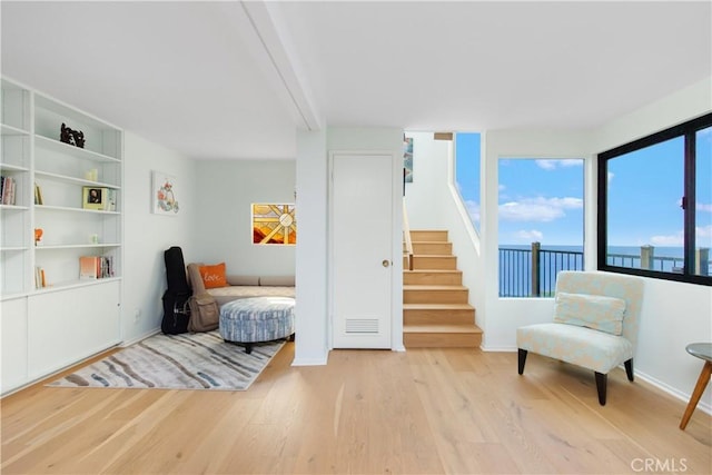 living area with light hardwood / wood-style flooring