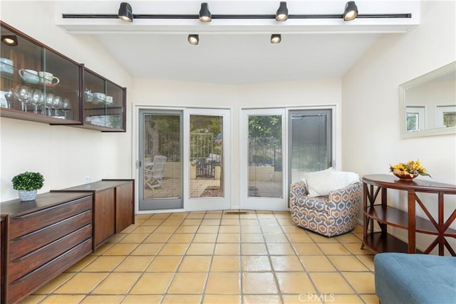 entryway with light tile patterned floors