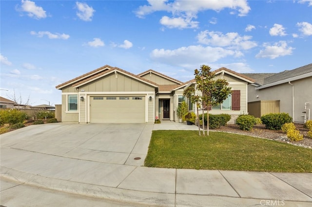 view of front of house with a garage and a front lawn