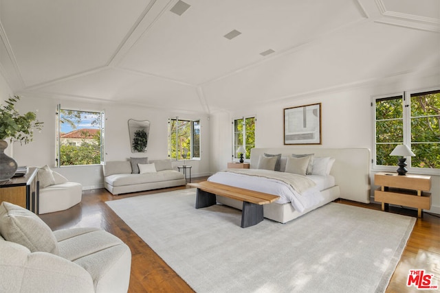 bedroom featuring hardwood / wood-style flooring and vaulted ceiling