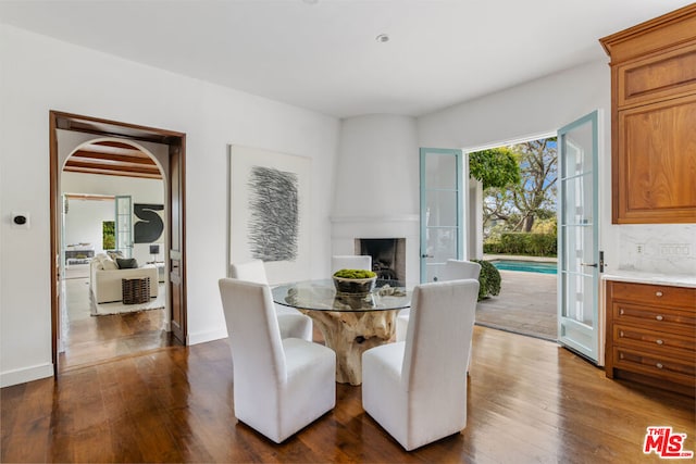 dining area featuring dark wood-type flooring