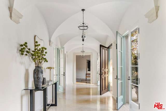 hallway with vaulted ceiling