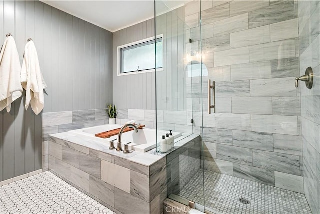 bathroom featuring tile patterned floors and independent shower and bath