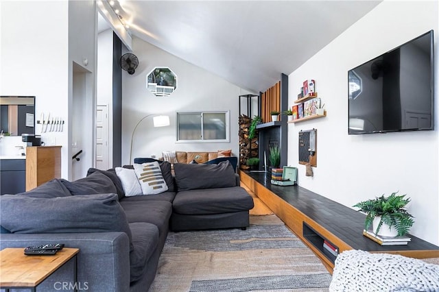 living room with lofted ceiling and hardwood / wood-style floors