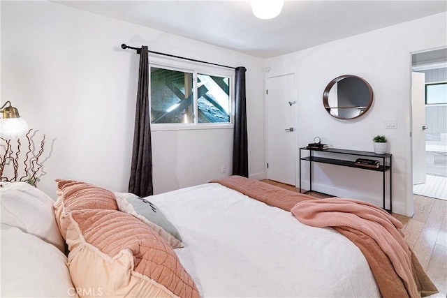 bedroom with light wood-type flooring