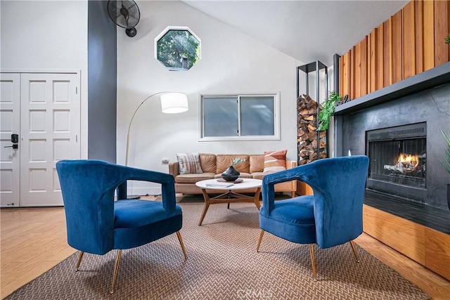 living room featuring hardwood / wood-style floors and vaulted ceiling