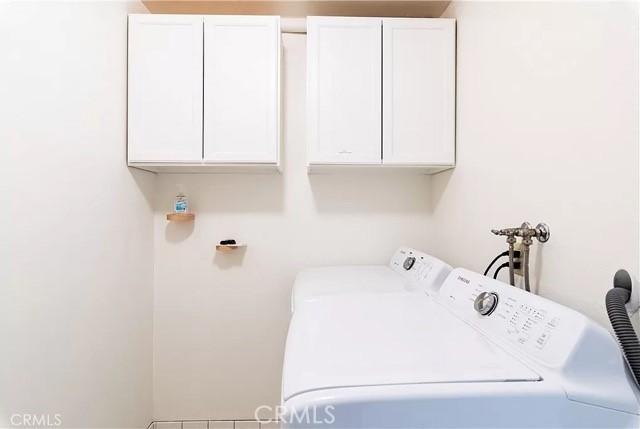 555 Dover Ct, Lake Arrowhead, CA 92352 - laundry area featuring washer and clothes dryer and cabinet space