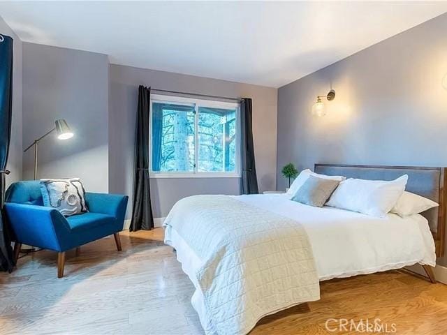 555 Dover Ct, Lake Arrowhead, CA 92352 - bedroom with baseboards and wood finished floors