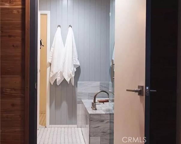 555 Dover Ct, Lake Arrowhead, CA 92352 - full bathroom with a bathing tub and tile patterned flooring