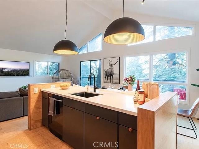 555 Dover Ct, Lake Arrowhead, CA 92352 - kitchen with light countertops, black dishwasher, a sink, open floor plan, and pendant lighting