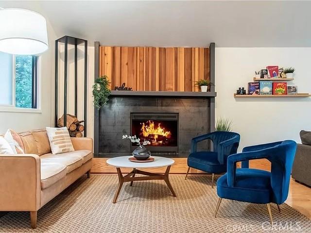 555 Dover Ct, Lake Arrowhead, CA 92352 - sitting room with wood finished floors and a large fireplace