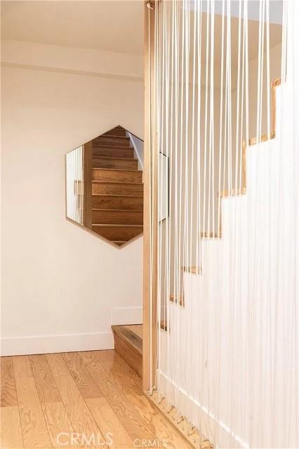 555 Dover Ct, Lake Arrowhead, CA 92352 - stairs featuring baseboards and wood finished floors