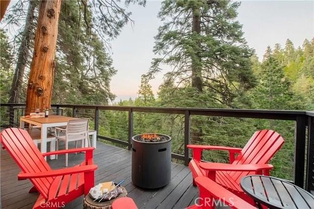 555 Dover Ct, Lake Arrowhead, CA 92352 - wooden terrace featuring outdoor dining area