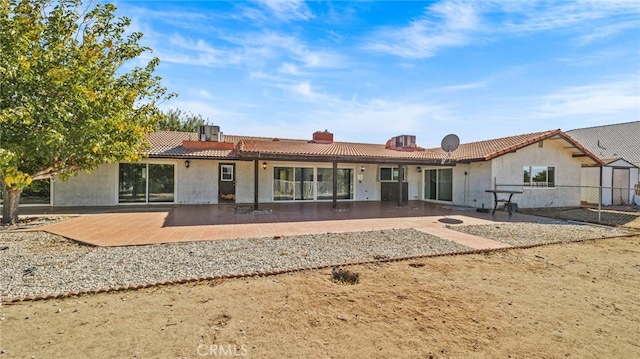 rear view of house featuring a patio area