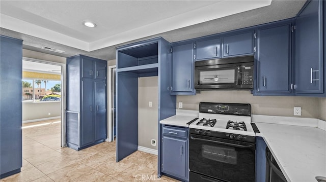 kitchen featuring blue cabinets, light tile patterned flooring, and gas range oven