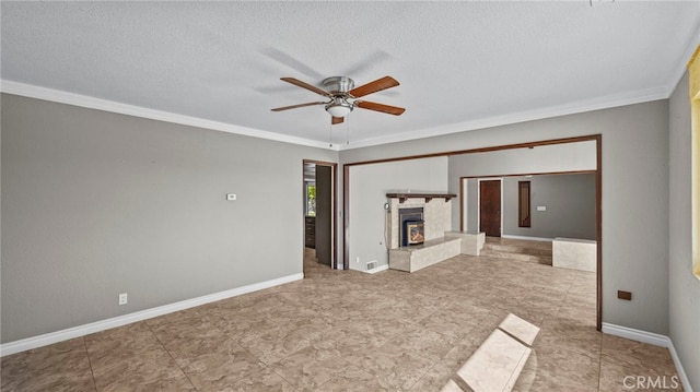 unfurnished living room with crown molding, a textured ceiling, ceiling fan, and a high end fireplace