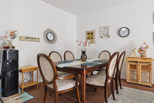 view of carpeted dining area