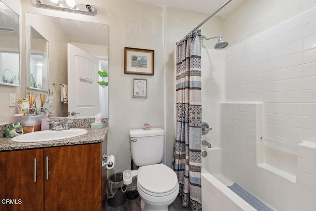 full bathroom with vanity, shower / bath combination with curtain, and toilet