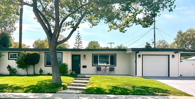 ranch-style house with a garage and a front yard