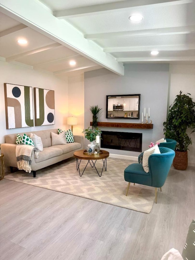 living room featuring vaulted ceiling with beams and hardwood / wood-style floors