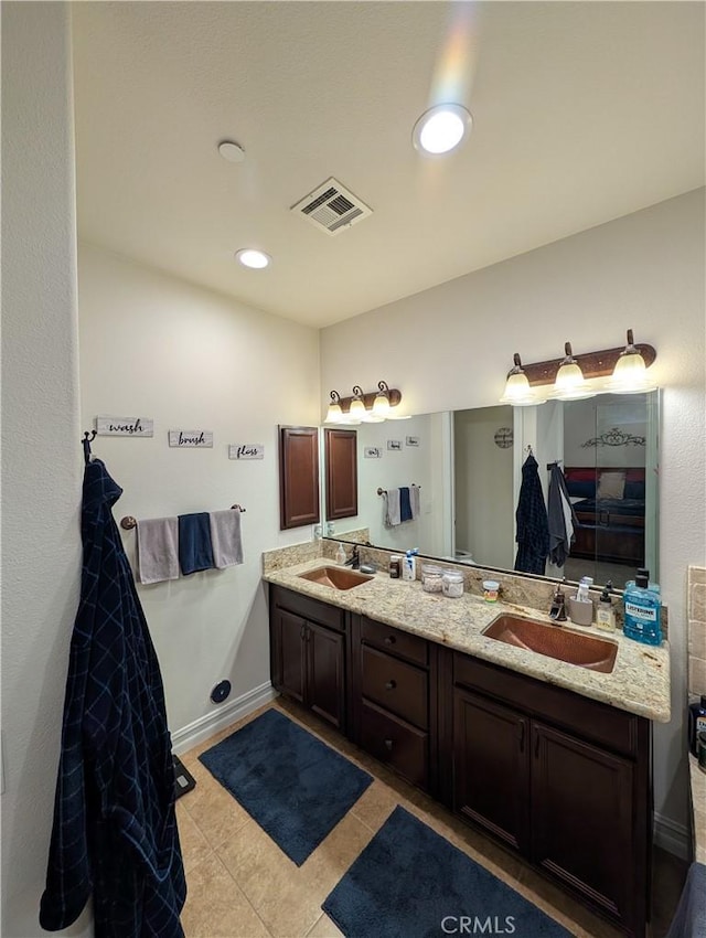 bathroom with vanity and tile patterned flooring